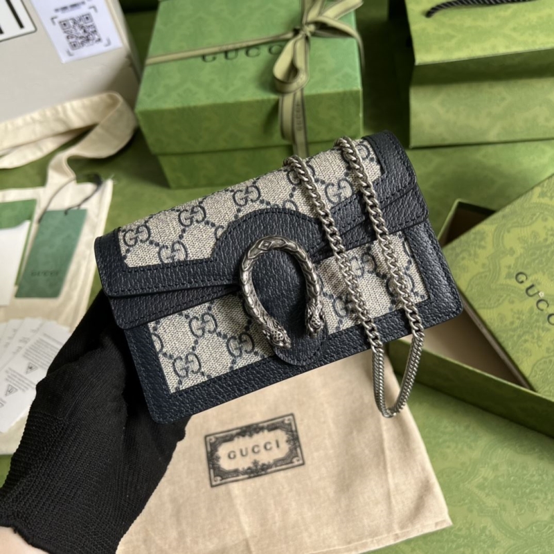 G*u*i clutch bags